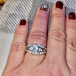 3/4 carat with side diamonds and two ring guard bands. Size 8